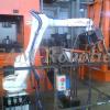 работа промышленного робота по станком